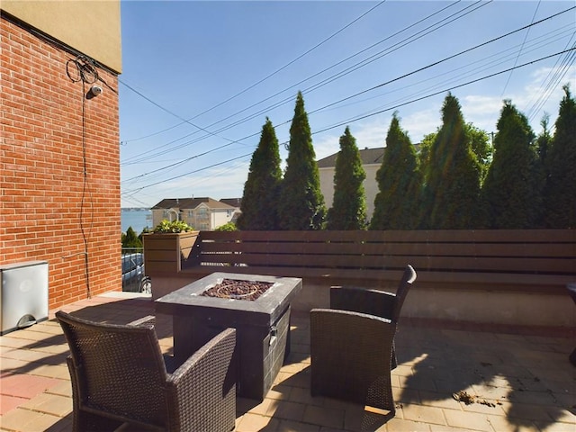 view of patio with a fire pit