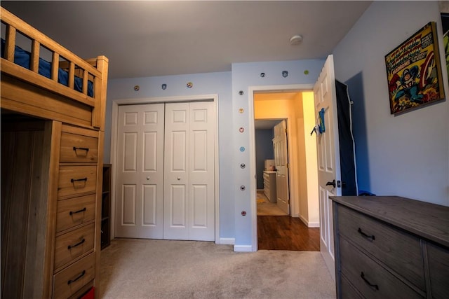 bedroom featuring dark carpet and a closet