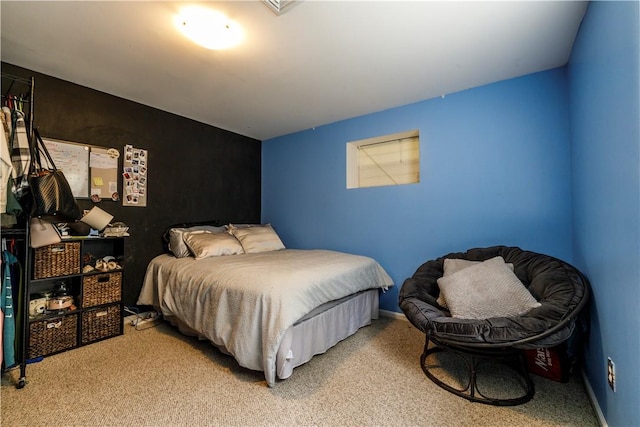 bedroom featuring light colored carpet