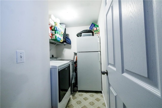 laundry area featuring washing machine and clothes dryer