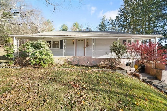 ranch-style home featuring a front yard