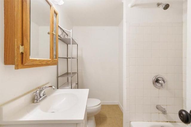 full bathroom featuring tile patterned flooring, vanity, toilet, and tiled shower / bath combo