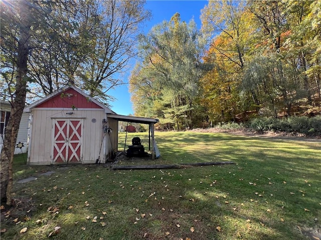 view of outbuilding featuring a lawn