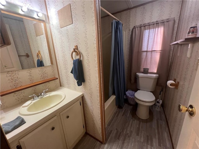 full bathroom with wood-type flooring, vanity, toilet, and shower / bath combo with shower curtain