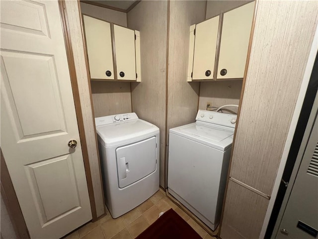 laundry area featuring cabinets and separate washer and dryer