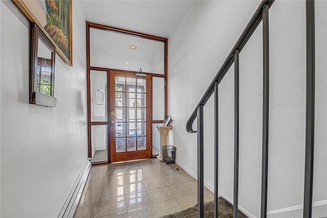 doorway to outside featuring french doors and a baseboard radiator