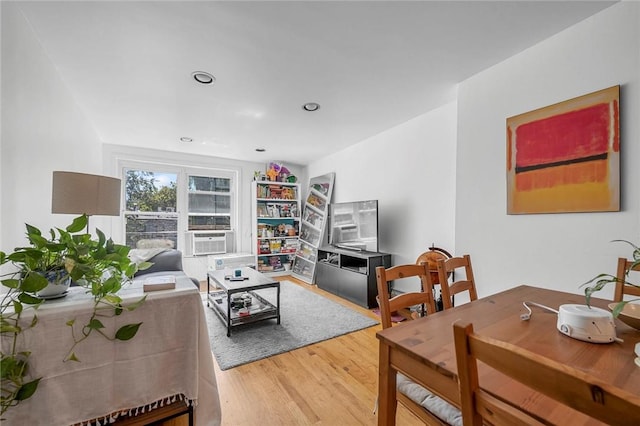 living room featuring hardwood / wood-style flooring and cooling unit