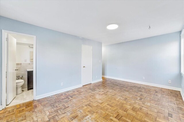 empty room featuring light parquet flooring