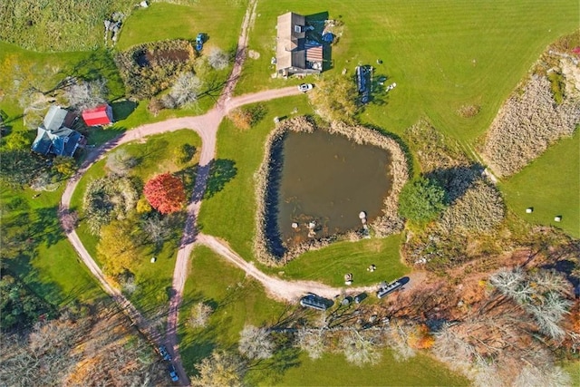 birds eye view of property with a rural view and a water view