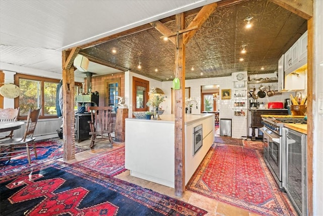 kitchen featuring stainless steel appliances and white cabinetry