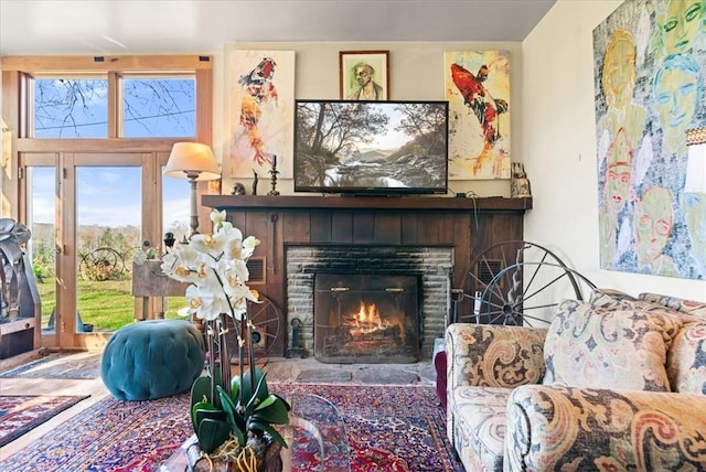 living area featuring a brick fireplace