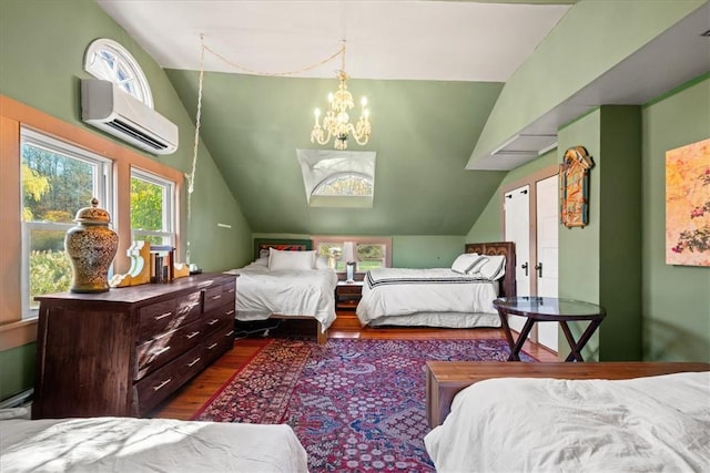 bedroom with dark hardwood / wood-style flooring, an inviting chandelier, vaulted ceiling, and a wall mounted AC