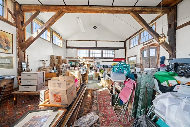 misc room featuring beam ceiling and high vaulted ceiling