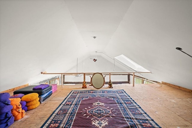 game room featuring vaulted ceiling with skylight