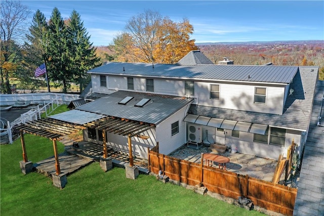 rear view of house with a yard and a pergola