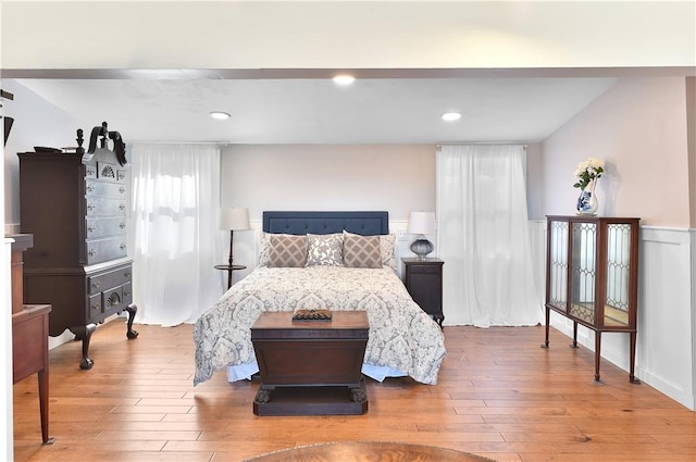 bedroom with hardwood / wood-style flooring