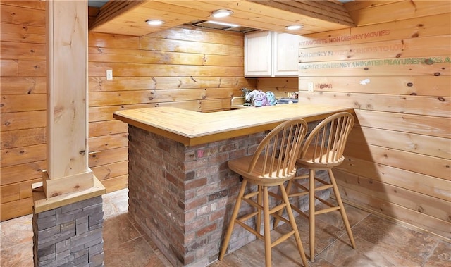 bar featuring wood walls