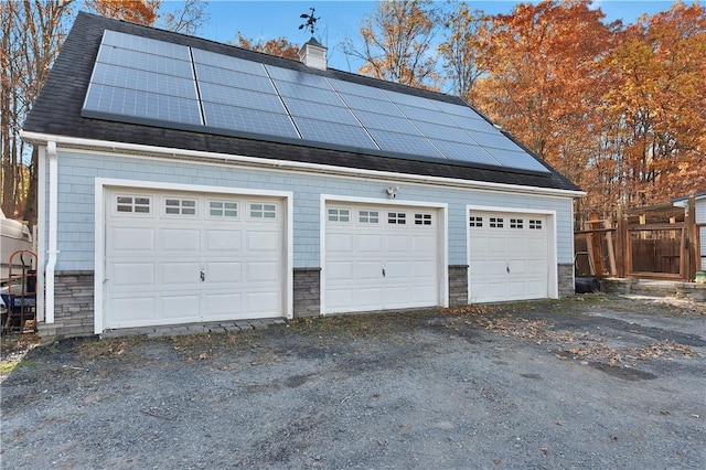 garage featuring solar panels