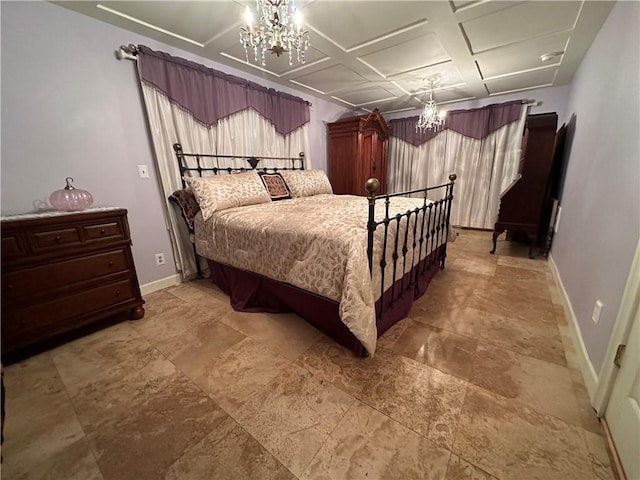 bedroom with a notable chandelier and coffered ceiling