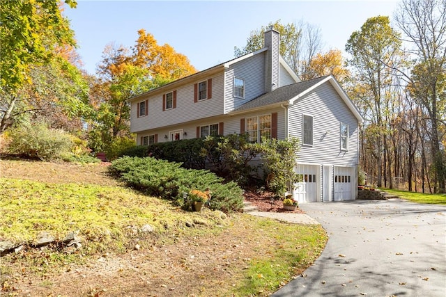 view of side of home with a garage