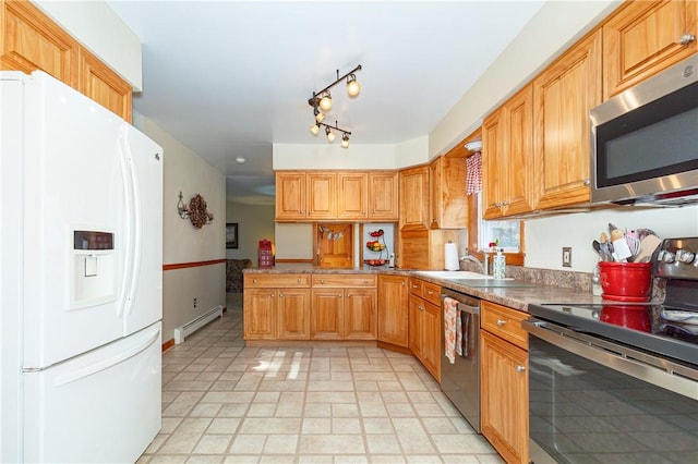 kitchen with kitchen peninsula, sink, appliances with stainless steel finishes, and a baseboard heating unit