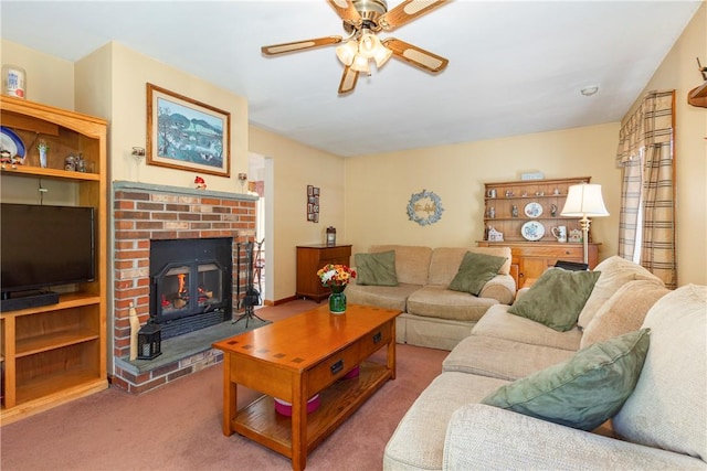 living room with carpet, ceiling fan, and a fireplace