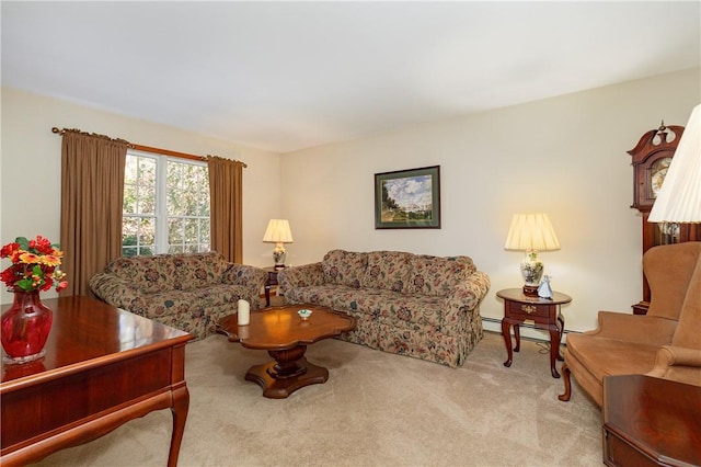 living room featuring light carpet and a baseboard heating unit