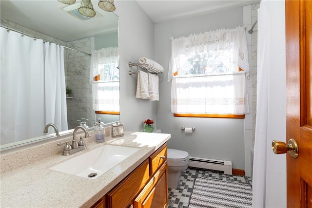 bathroom with tile patterned flooring, vanity, a baseboard radiator, and toilet