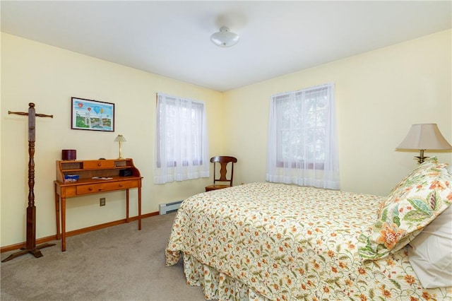 bedroom with baseboard heating and light colored carpet