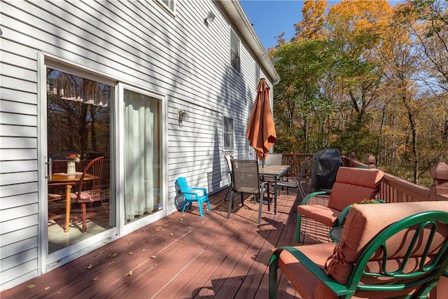 wooden deck with area for grilling