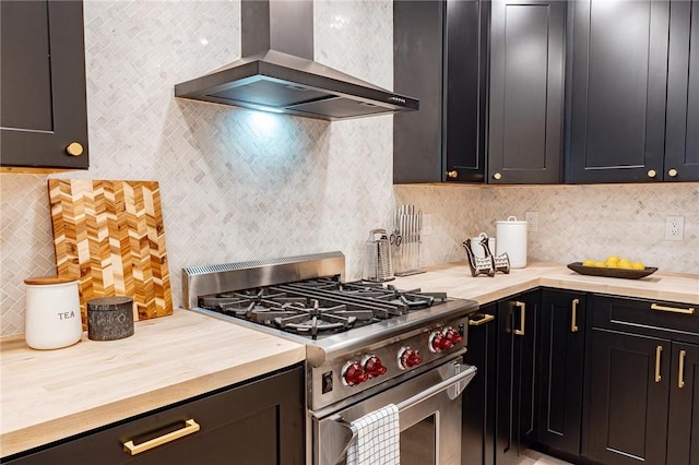 kitchen featuring gas range, ventilation hood, and decorative backsplash