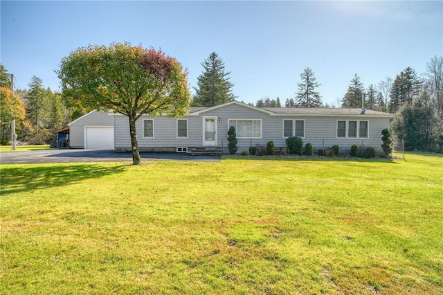 ranch-style house with a front lawn and a garage