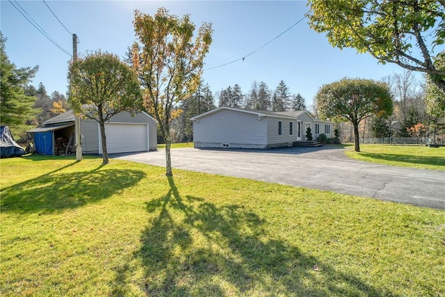 view of property exterior featuring a lawn, a garage, and an outdoor structure