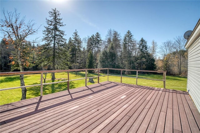 wooden deck with a lawn