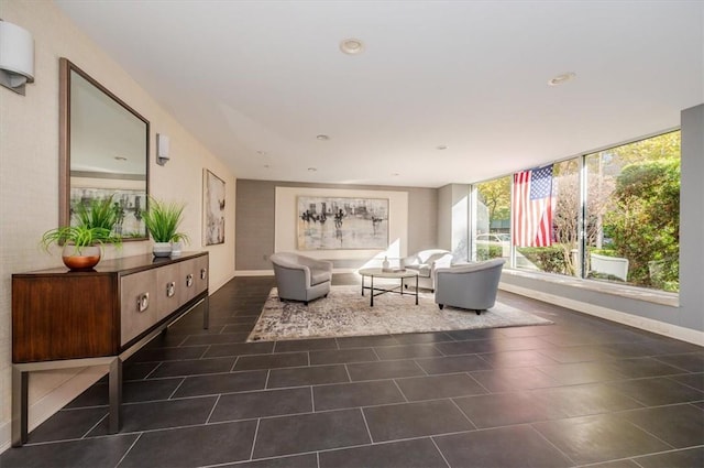 living area featuring dark tile patterned floors