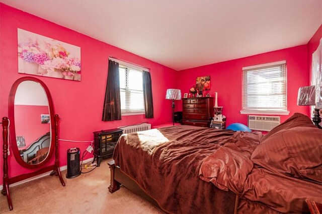 carpeted bedroom with a wall mounted air conditioner