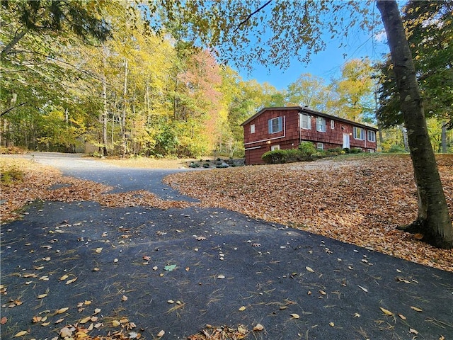 view of side of home featuring a garage