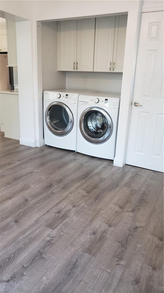 laundry area with stacked washer / dryer