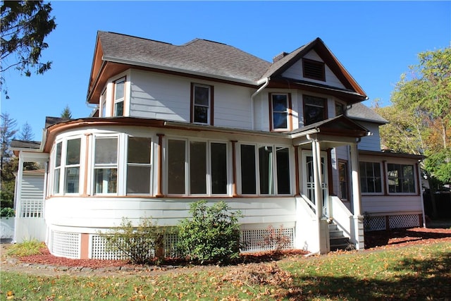 view of front facade with a sunroom