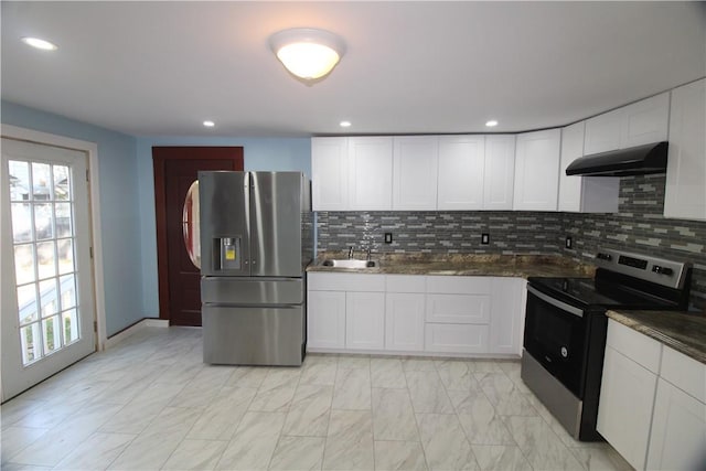 kitchen featuring sink, stainless steel appliances, backsplash, extractor fan, and white cabinets