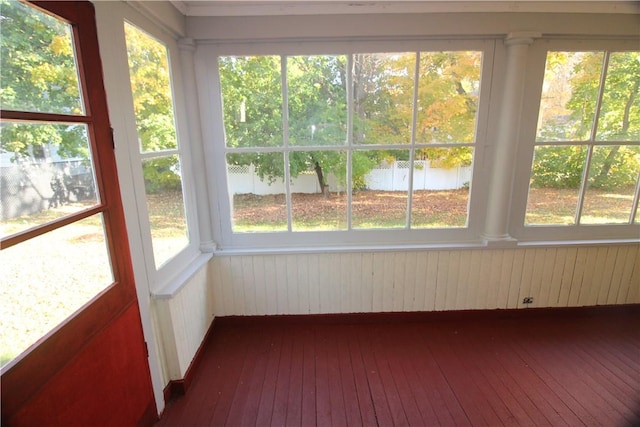 unfurnished sunroom featuring radiator