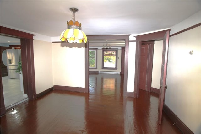 unfurnished dining area featuring a notable chandelier and dark wood-type flooring