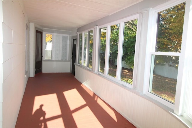 unfurnished sunroom with plenty of natural light