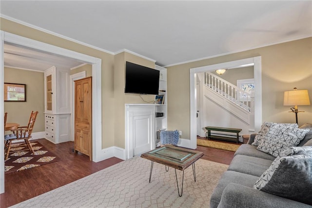 living room featuring dark hardwood / wood-style flooring and crown molding