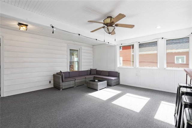 carpeted living room with plenty of natural light and ceiling fan