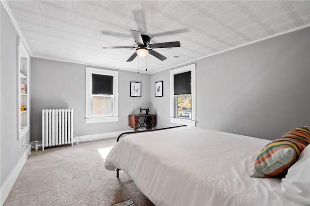 bedroom with radiator, ceiling fan, light carpet, and ornamental molding