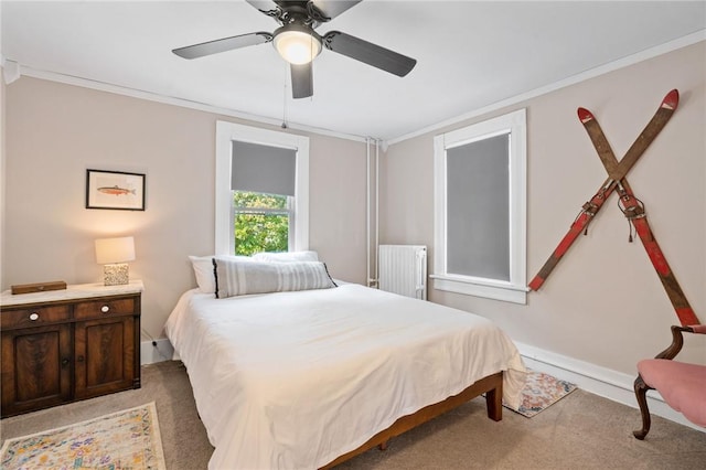 bedroom featuring radiator heating unit, carpet floors, ceiling fan, and ornamental molding