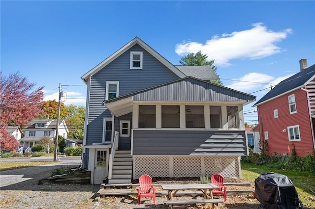 view of front facade featuring a sunroom