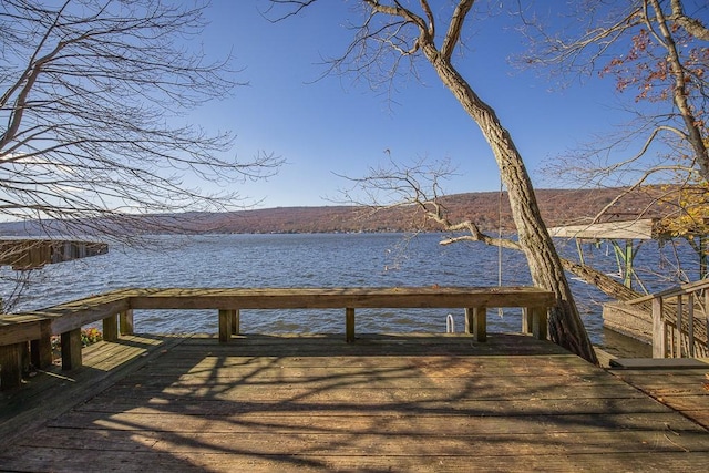 dock area featuring a water and mountain view