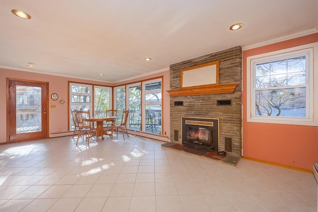 unfurnished living room with a large fireplace, ornamental molding, and light tile patterned floors